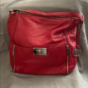Beautiful authentic red Michael Kors bag.